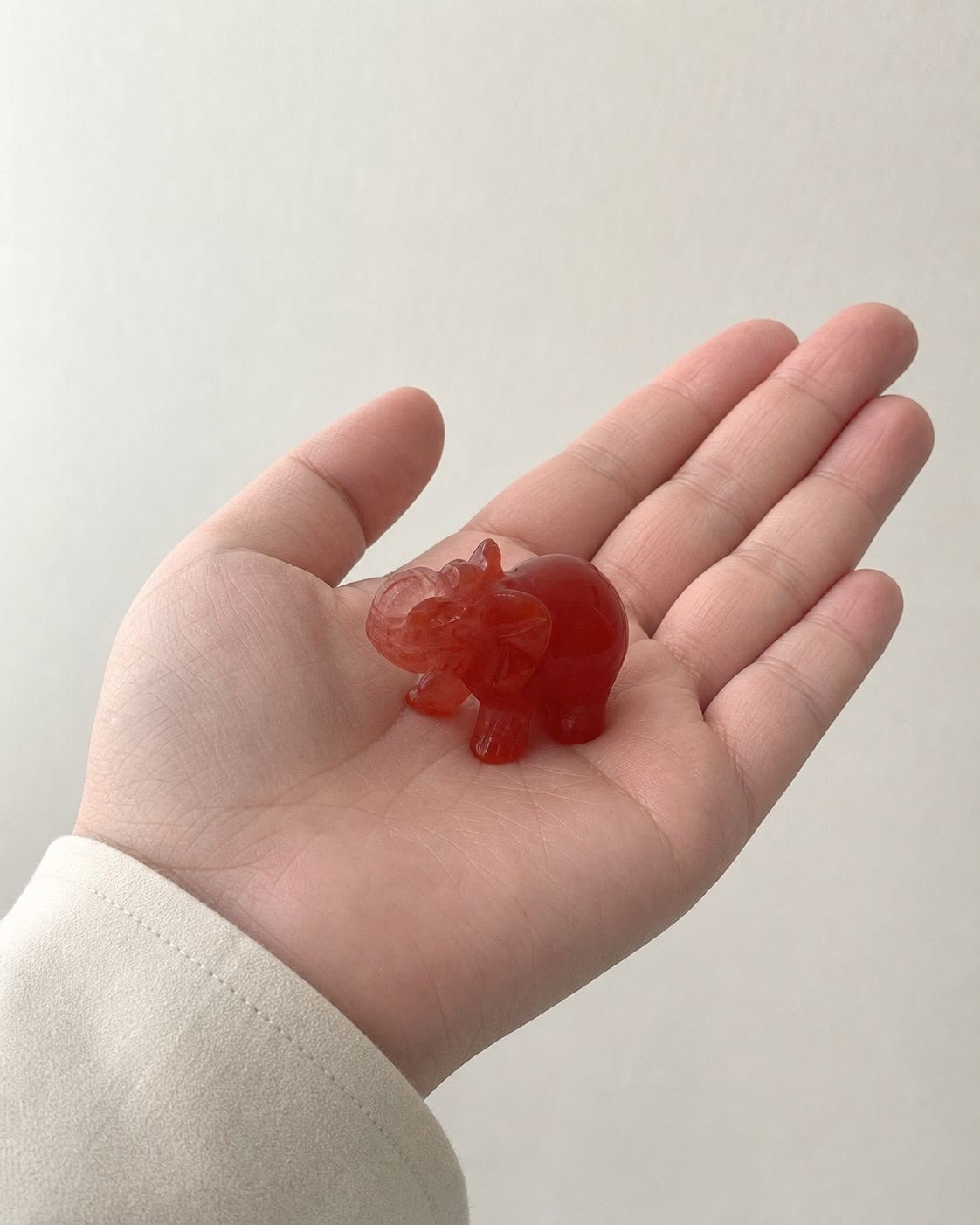 Carnelian Elephant, hand-carved gemstone sculpture in natural carnelian, alternate view