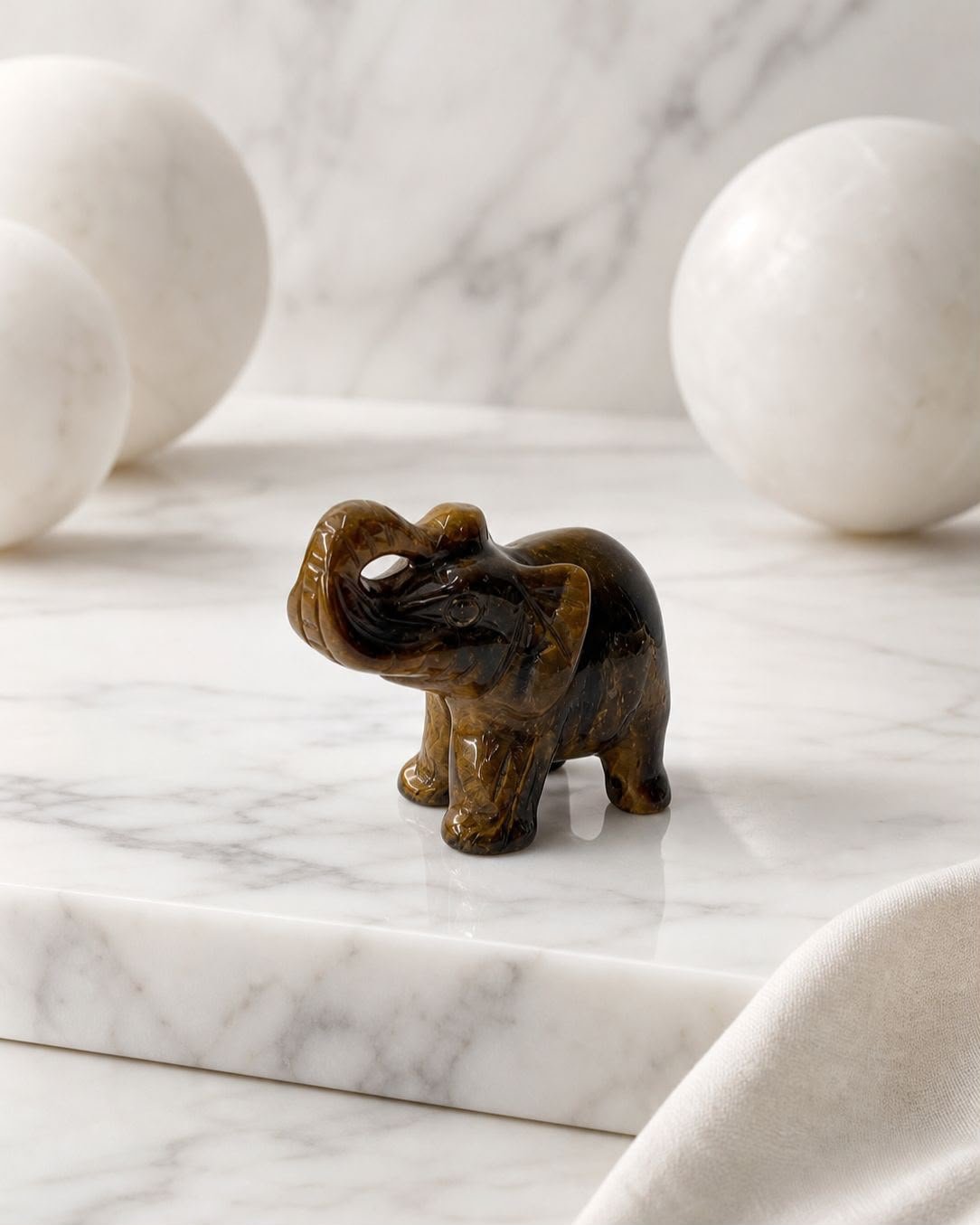 Brown Tiger Eye Elephant, hand-carved gemstone sculpture in natural brown tiger eye